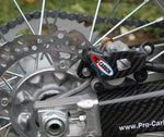 Load image into Gallery viewer, PRO CARBON HONDA REAR CALIPER PROTECTOR ALL CR/CRF 2002-2024