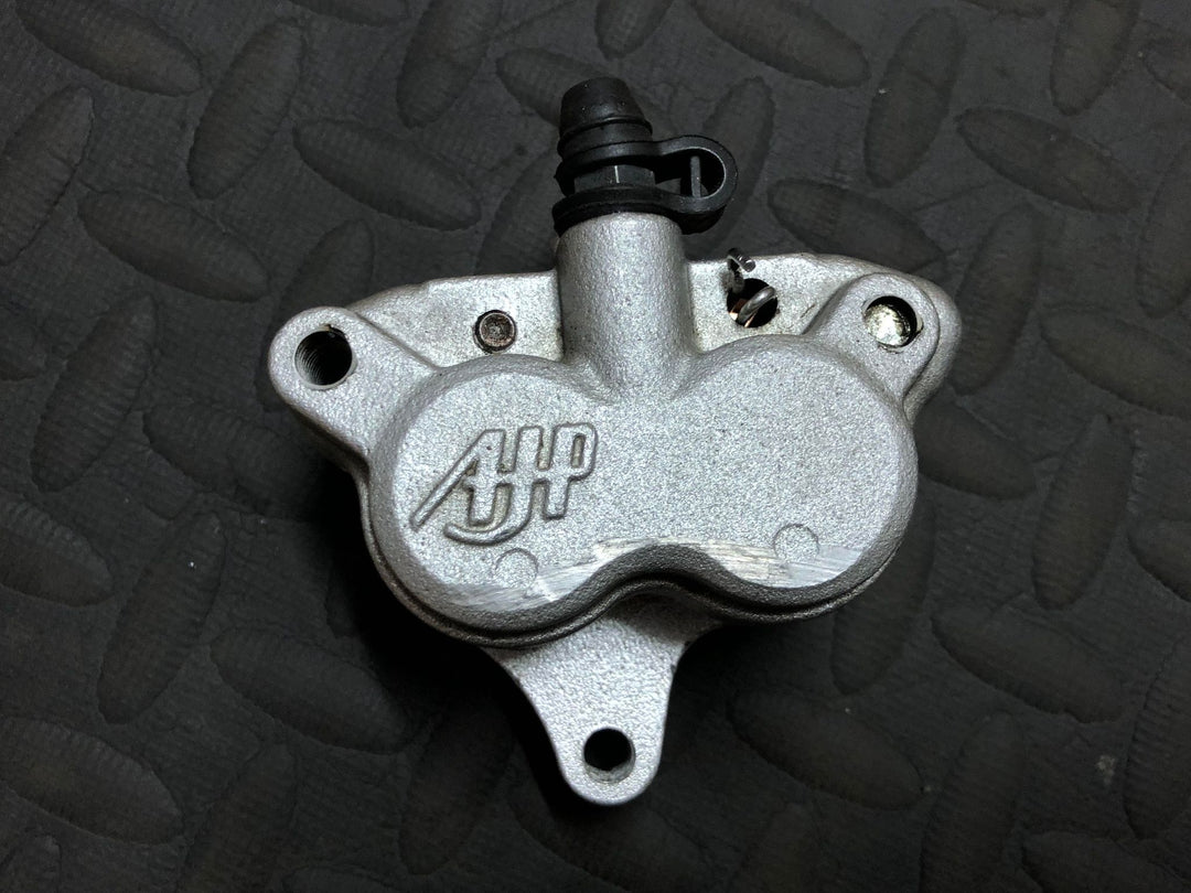 USED AJP 4 POT TRIALS FRONT BRAKE CALIPER